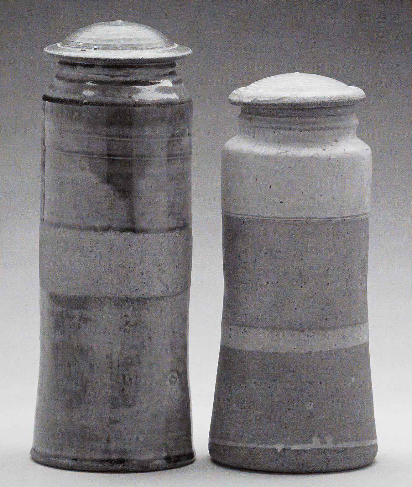 Heirloom Jars (Left) November 2003. Cone 11 woodfired stoneware, ash glaze over porcelain slip. H 12&quot; x W 5&quot;. (Right) March 1972, bisqued, Cone 10 gas reduction stoneware, spodumene glaze. H 10.25&quot; x W 5&quot;. Photograph by VanZandenbergen.
