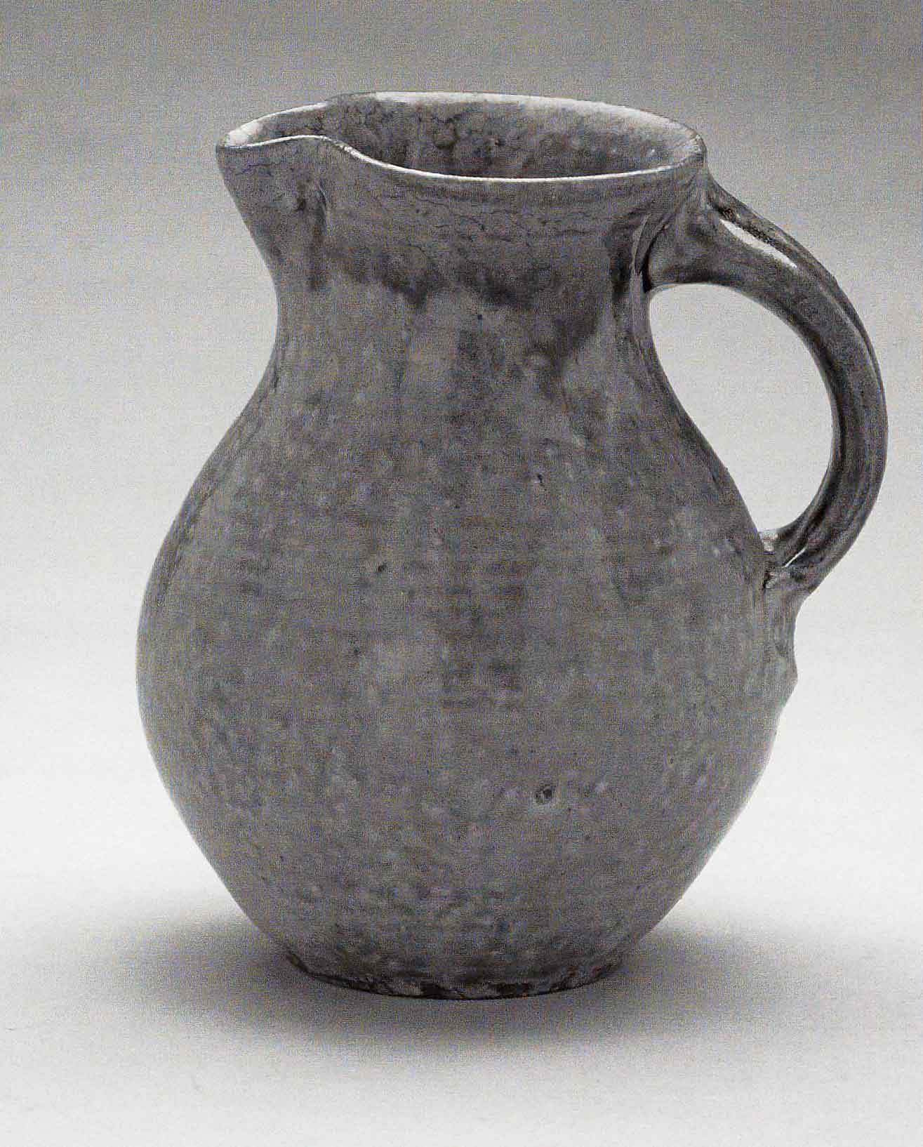 Jug, March 2005. Cone 10 woodfired stoneware, ash glaze over porcelain slip. H 7.5&quot; x W 6&quot;. Photograph by VanZandenbergen.