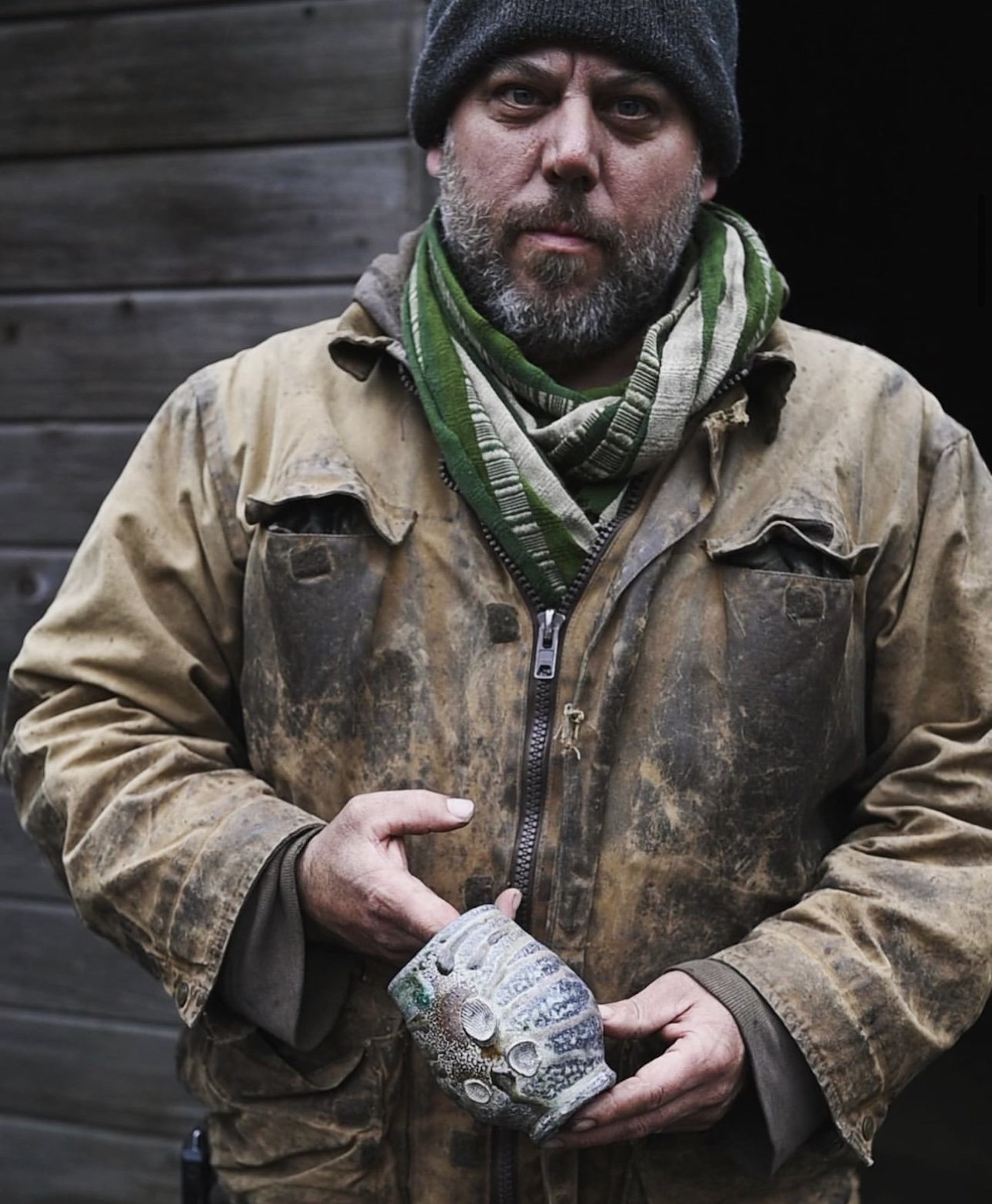 Nick Schwartz at Cider Creek Collective, 2022, Photo Credit: Jess Thompson. “I live in the woods by the ocean near Mendocino, CA, in a forest scarred by fire. The earth rumbles deep beneath my home, and the hills are constantly in motion. Much of my time is spent collecting and processing wood for firings, simply meandering my way from task to task, contentedly working with the land. I am trying to reestablish a long-forgotten language and dialogue with forces much greater than myself. I think about the speed at which the world around me is operating and the technology that is redefining our relationship with time and space. I am human; a brief dent in time, and a part of the matrix of all living things.”  —Nick Schwartz Artist Statement