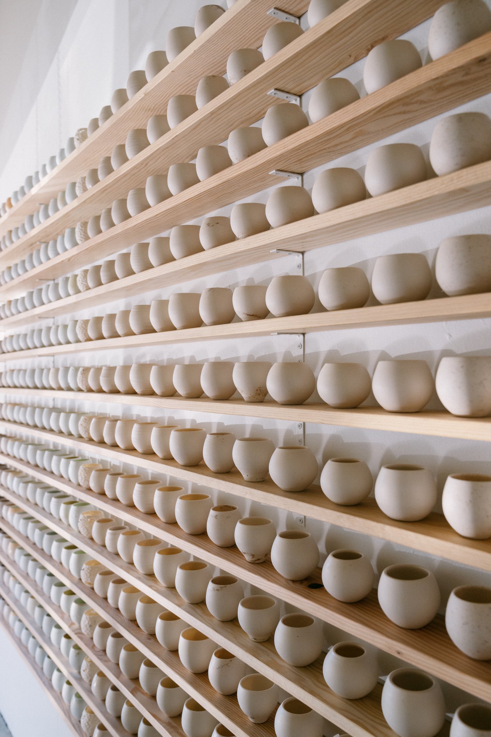 Details of cups from 365 piece installation “A Year and A Day” in the gallery. Image courtesy of Ty and Chey.