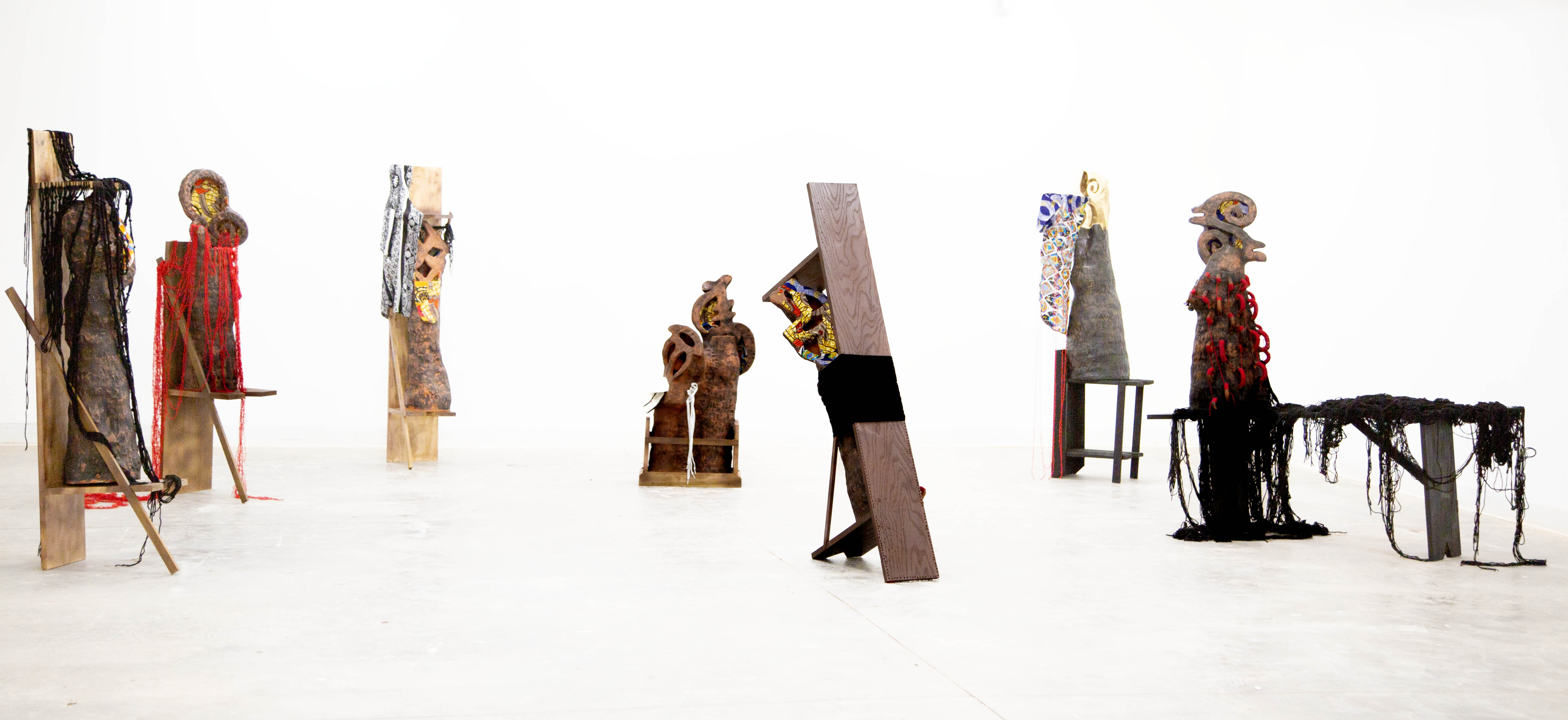 Eugene Ofori Agyei, Akan Adinkra series, 2025, earthenware clay, underglaze, batik fabric, yarns, wood, found objects, 165 x 93.4 x 173 inches. Photo credit: Eugene Ofori Agyei Eugene Ofori Agyei, Akan Adinkra series, 2025, earthenware clay, underglaze, batik fabric, yarns, wood, found objects, 165 x 93.4 x 173 inches. Photo credit: Eugene Ofori Agyei