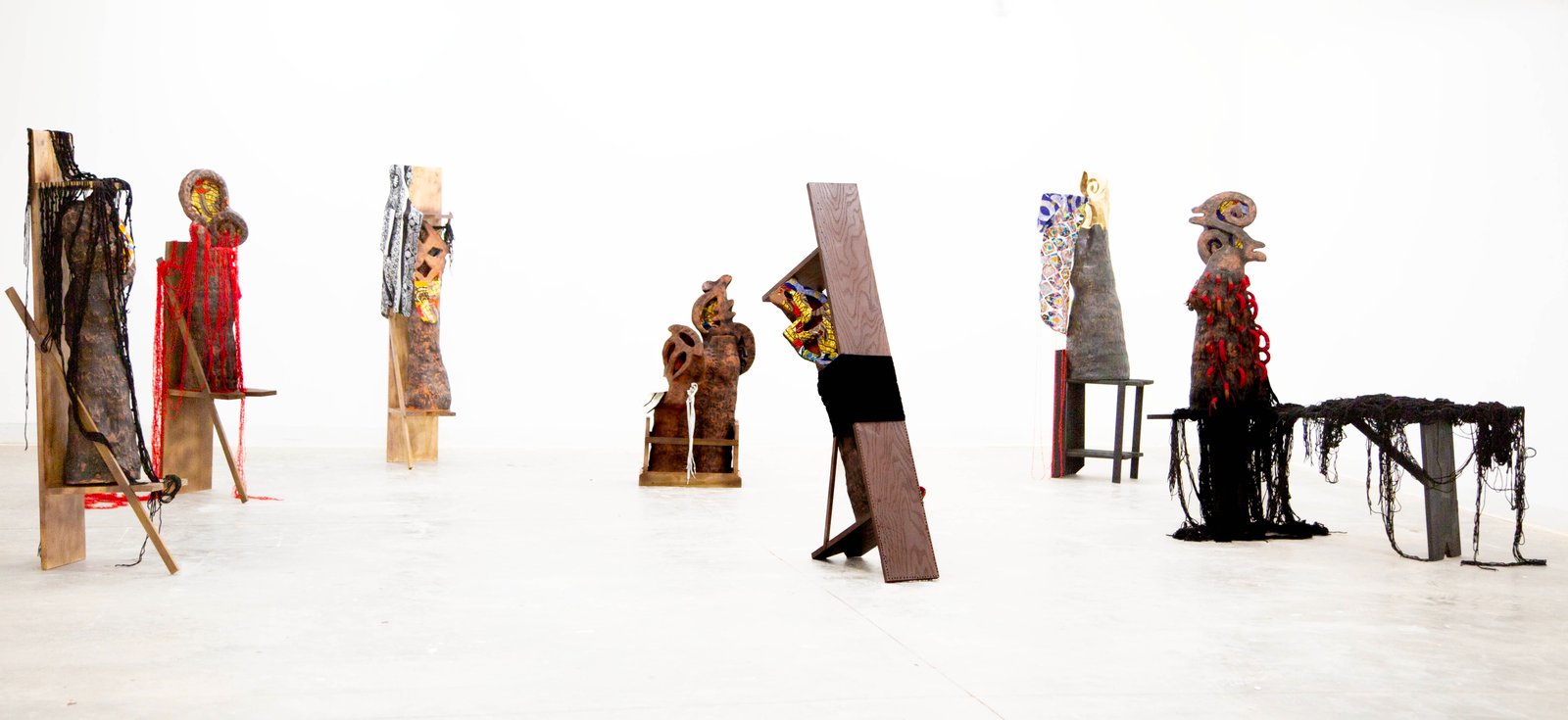 Eugene Ofori Agyei, Akan Adinkra series, 2025, earthenware clay, underglaze, batik fabric, yarns, wood, found objects, 165 x 93.4 x 173 inches. Photo credit: Eugene Ofori Agyei Eugene Ofori Agyei, Akan Adinkra series, 2025, earthenware clay, underglaze, batik fabric, yarns, wood, found objects, 165 x 93.4 x 173 inches. Photo credit: Eugene Ofori Agyei