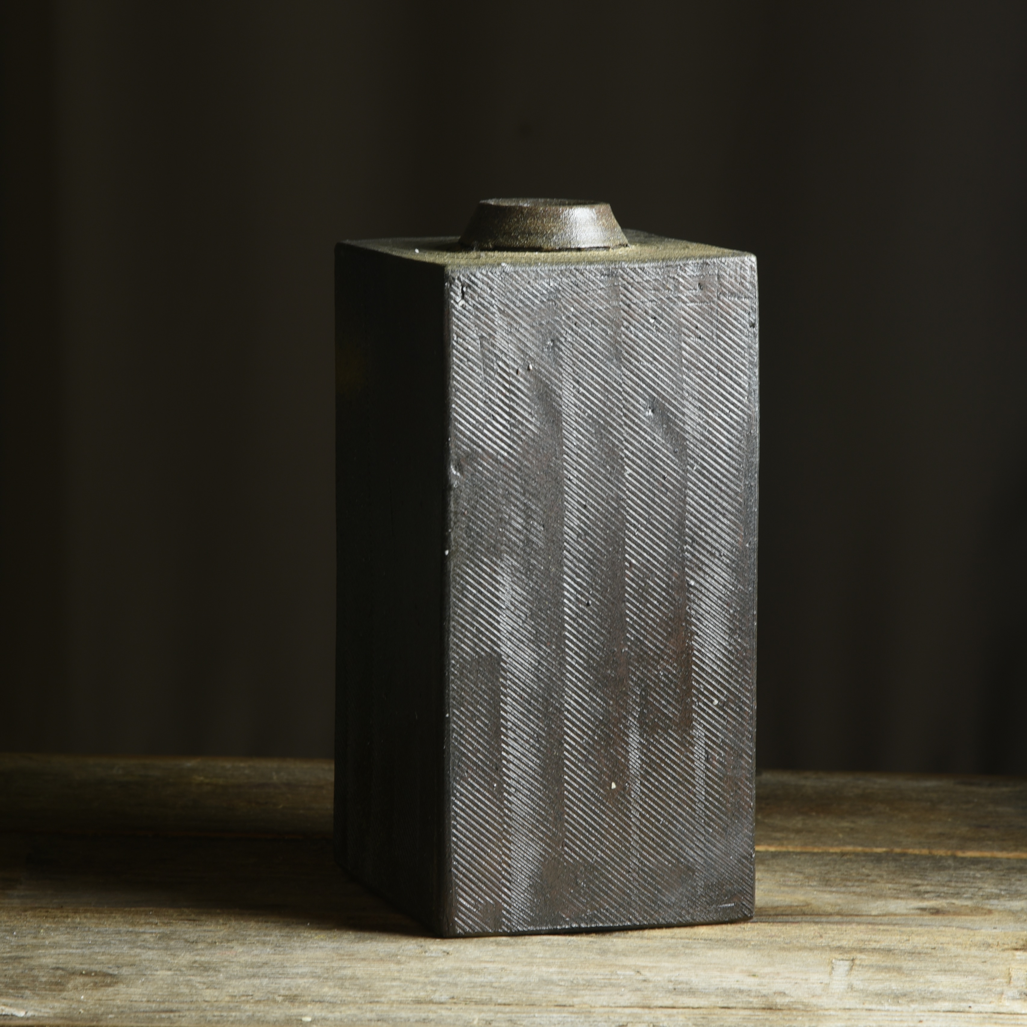 Stamped slab bottle, by Kate Gibbs, showing strong reduction cooling effects on the local clay. 