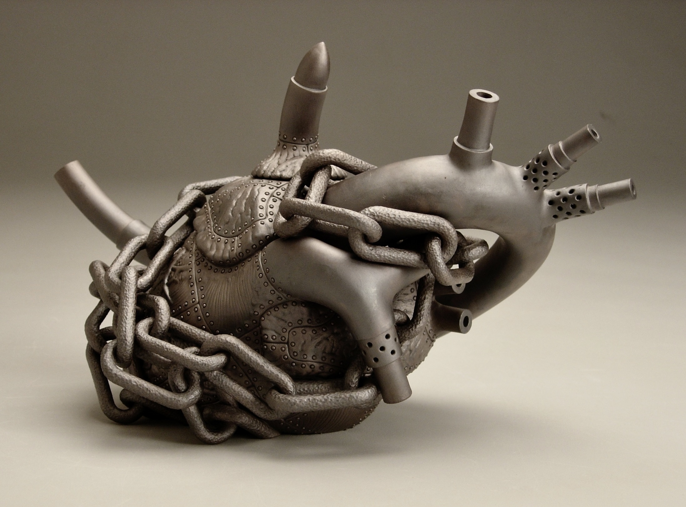 Heart Teapot - Hostage Metamorphosis IV, 2006, stoneware, lustre, 7 x 12.5 x 6. Photo courtesy of Richard Notkin.