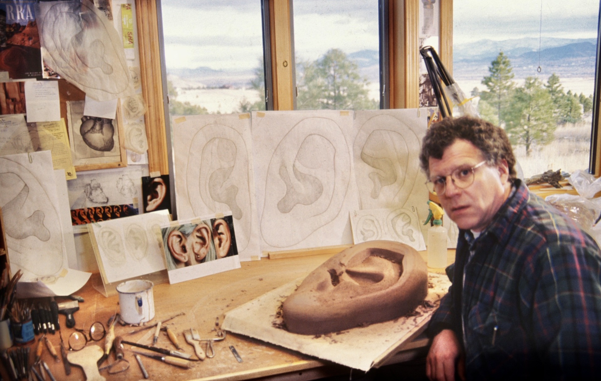 Richard Notkin in Helena, MT studio carving clay ear prototype models for "Legacy", 1998. Photo courtesy of Richard Notkin.