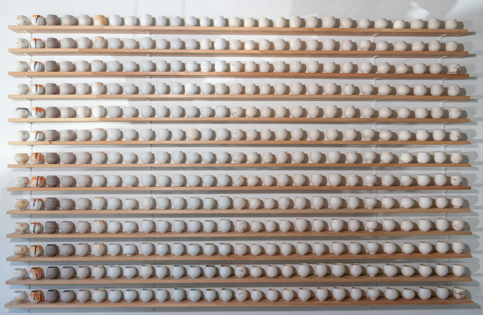 Details of cups from 365 piece installation “A Year and A Day” in the gallery. Image courtesy of Ty and Chey.