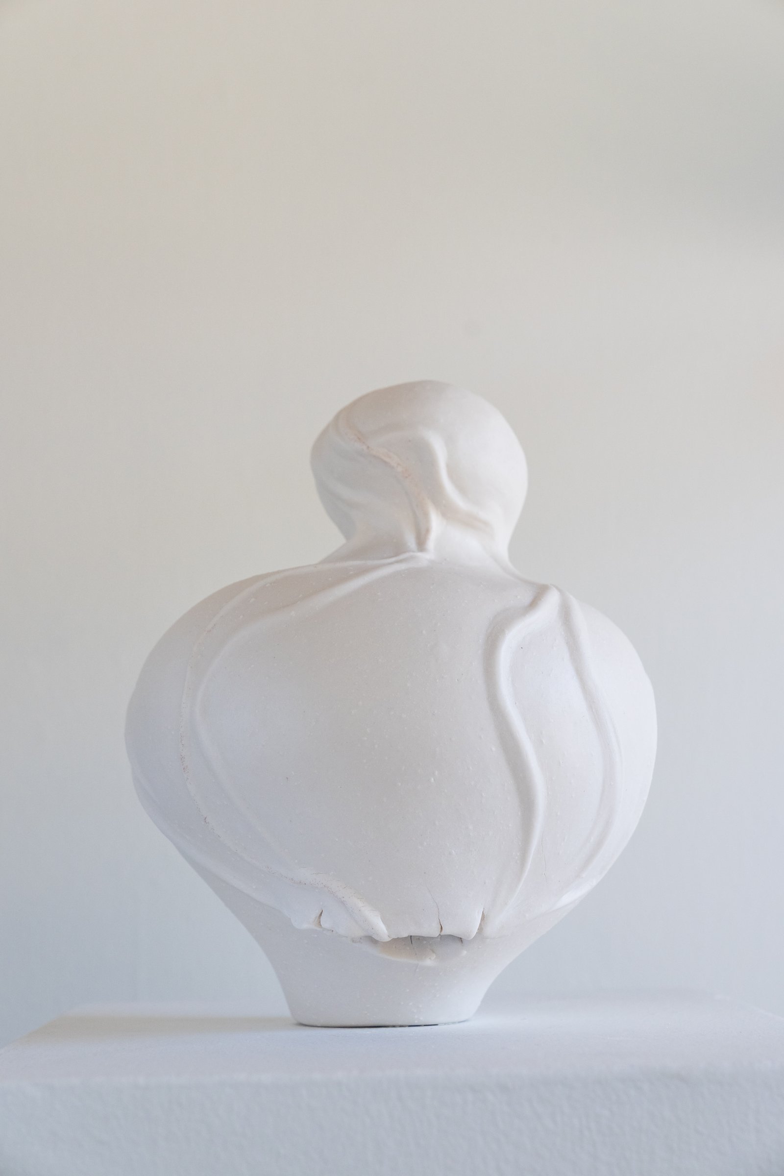 Venus, A Self Portrait” sculpted, cone 6, porcelain vessel with menstrual blood included in a singular vein flowing on the piece, in process coming out of glaze firing. Photo courtesy of Ty and Chey.